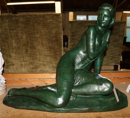 Cipriani. A green patinated terracotta figure of a kneeling woman(-)